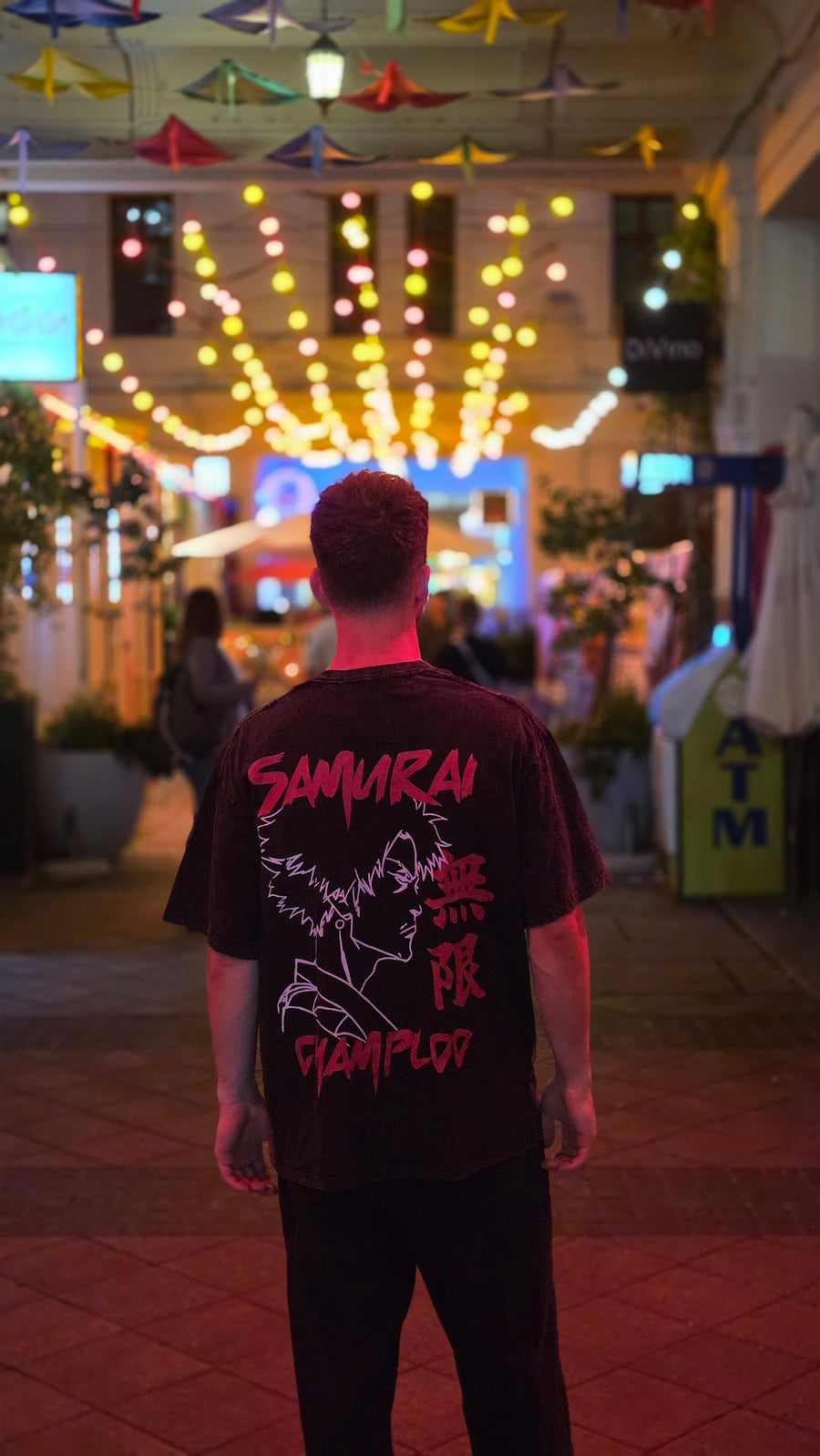 A fan wearing the SAMURAI CHAMPLOO TEE