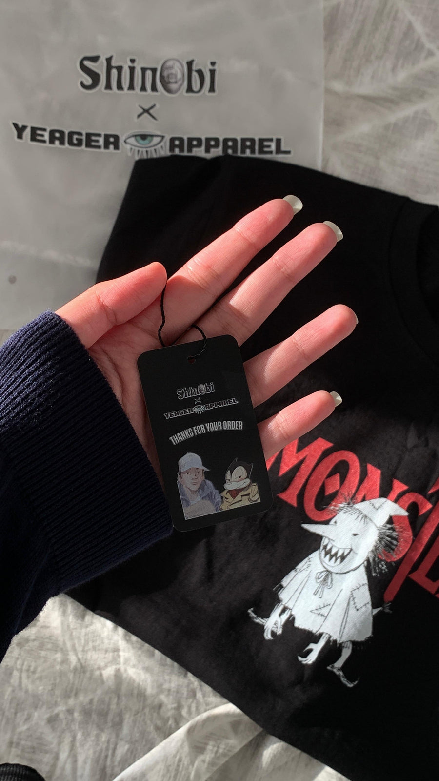 A fan wearing the MONSTER VINTAGE TEE