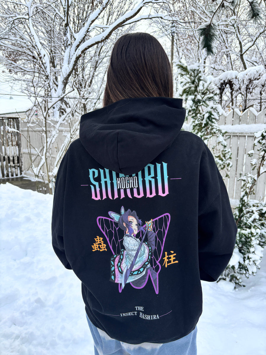 A fan wearing the SHINOBU - THE INSECT HASHIRA HOODIE