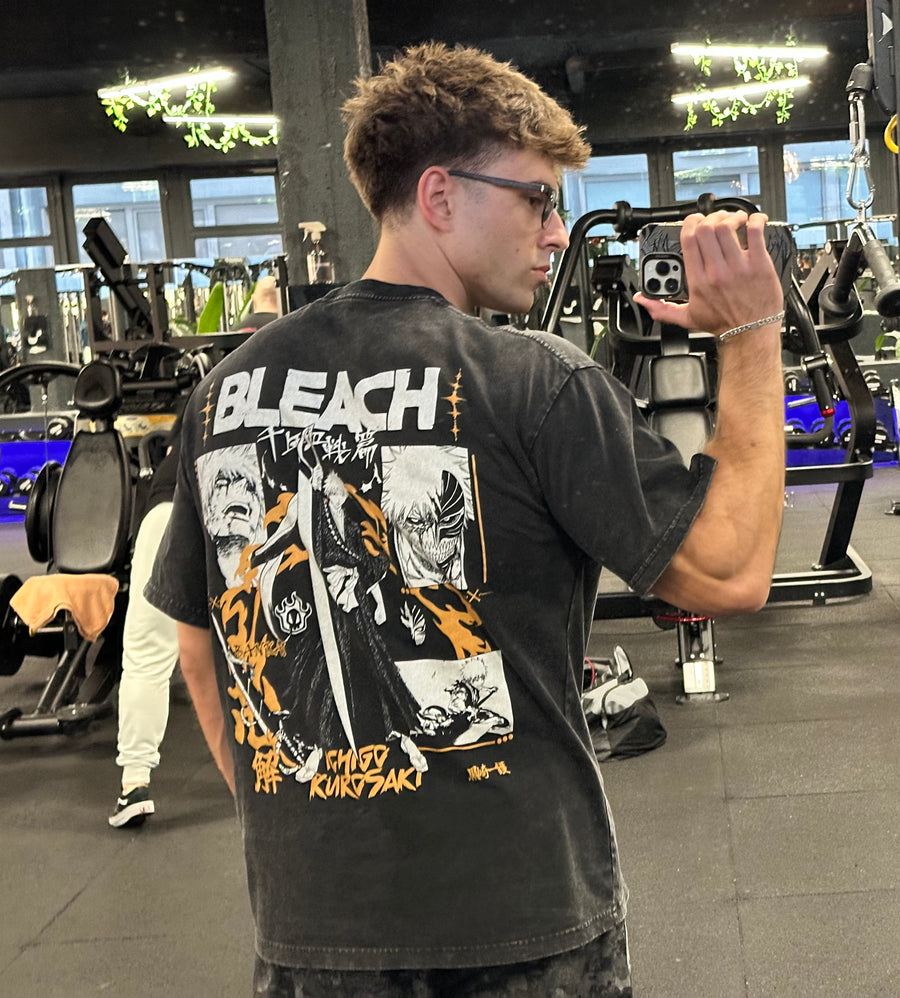 A fan wearing the Bleach Ichigo Kurosaki Vintage Graphic Tee