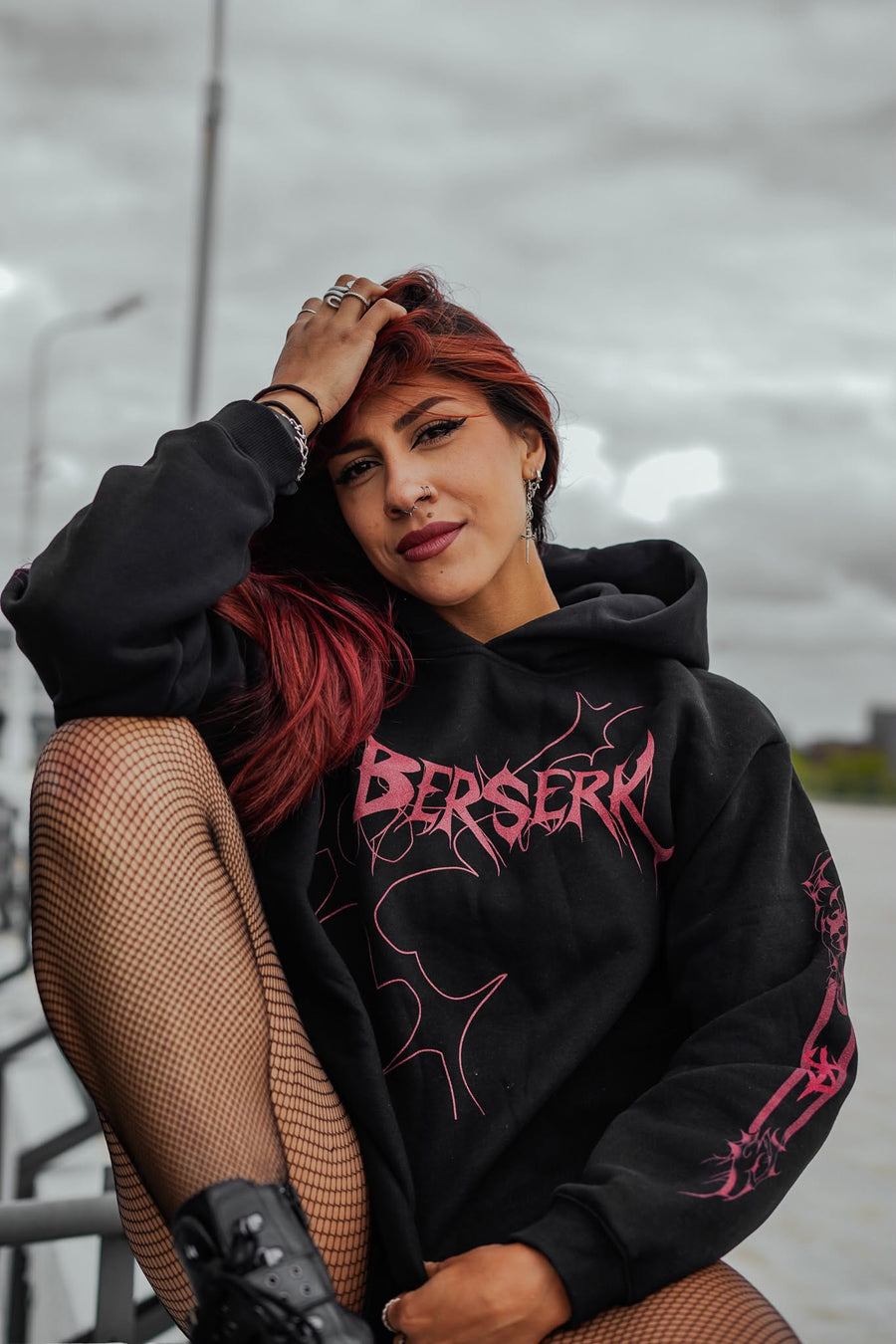 A fan wearing the Berserk Brand of Sacrifice Guts Anime Hoodie