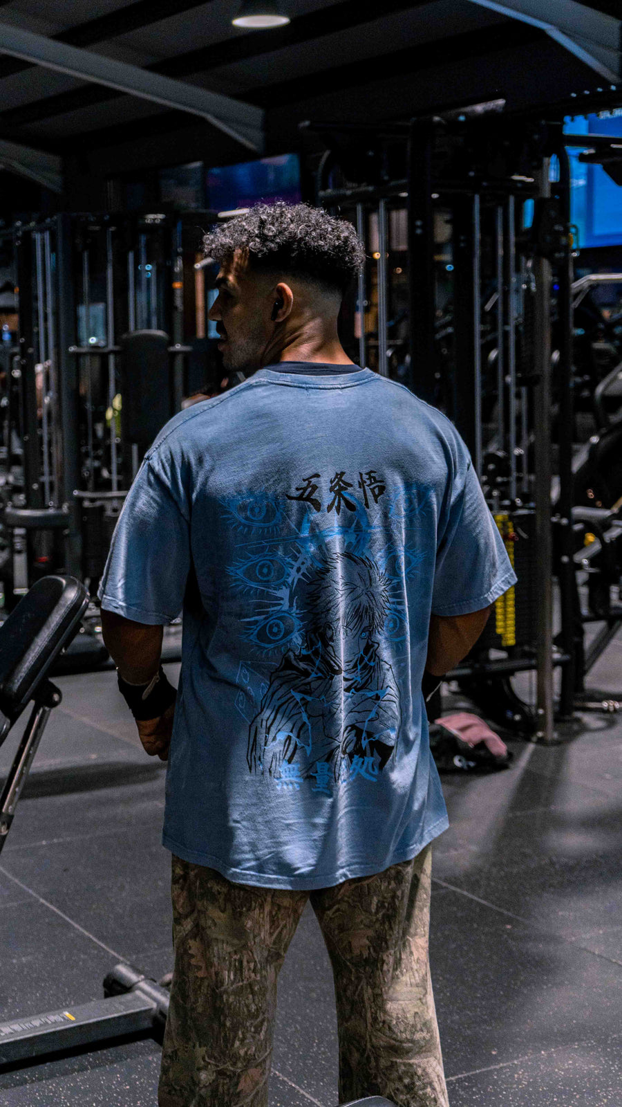 A fan wearing the Jujutsu Kaisen Gojo Six Eyes Graphic Tee