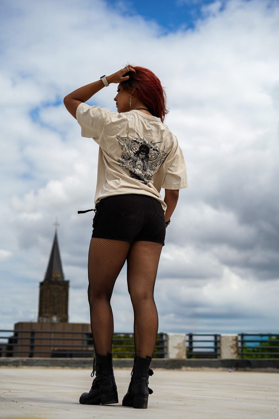 A fan wearing the AOT TITANS TEE