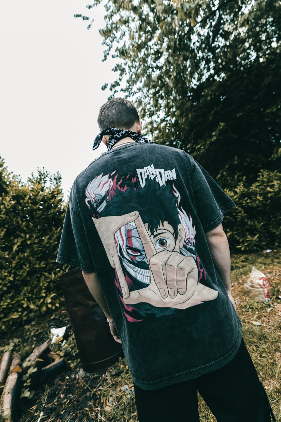 A fan wearing the OKARUN VINTAGE TEE