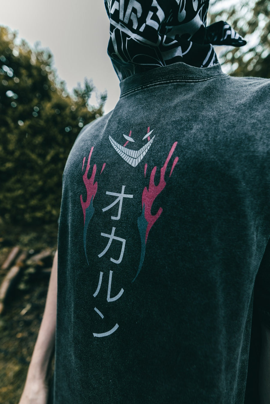 A fan wearing the OKARUN VINTAGE TEE