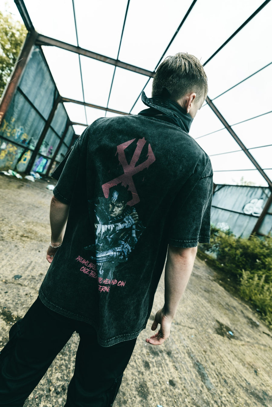 A fan wearing the BERSERK VINTAGE TEE